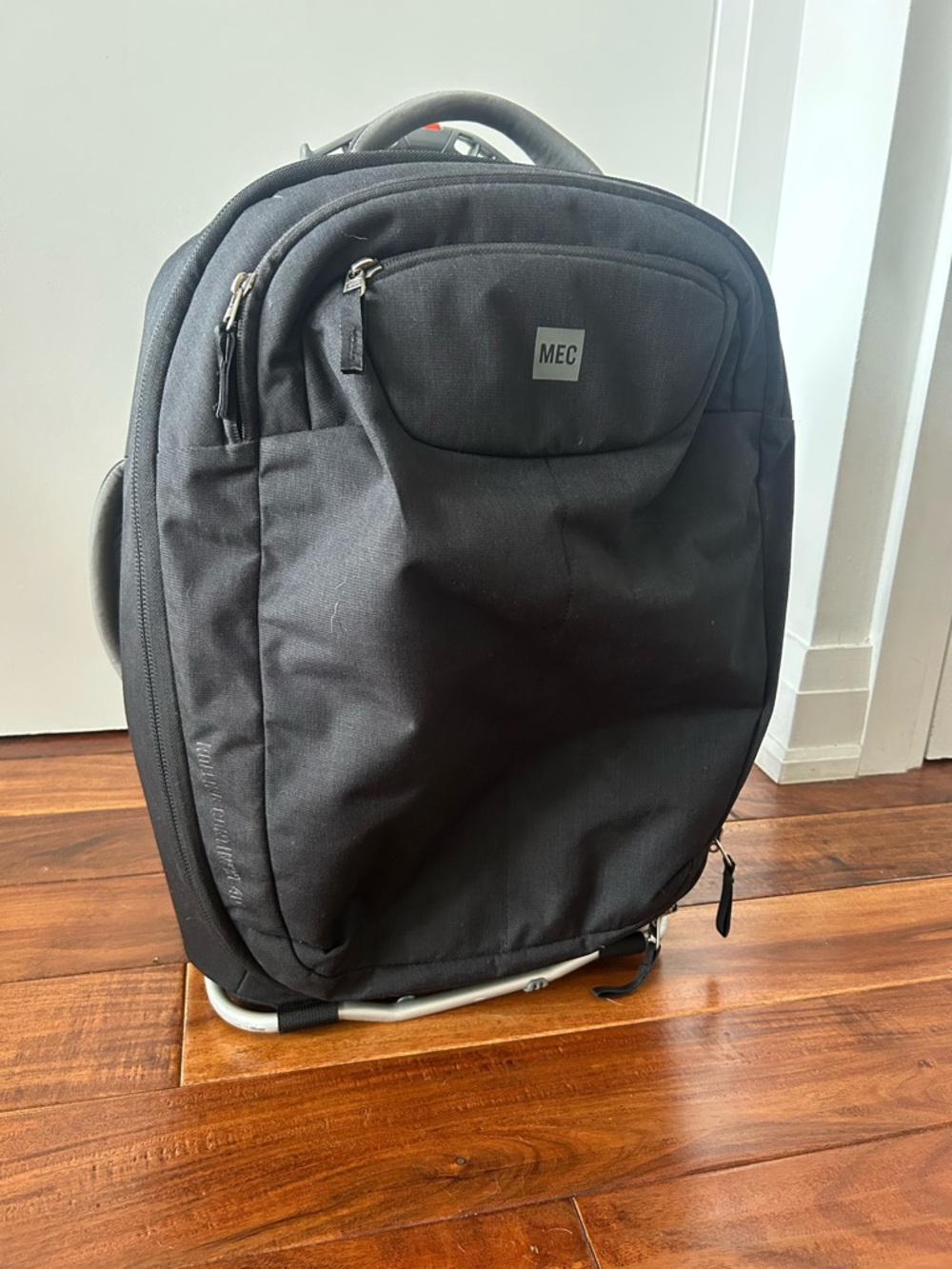 MEC Black Travel Rolling Backpack